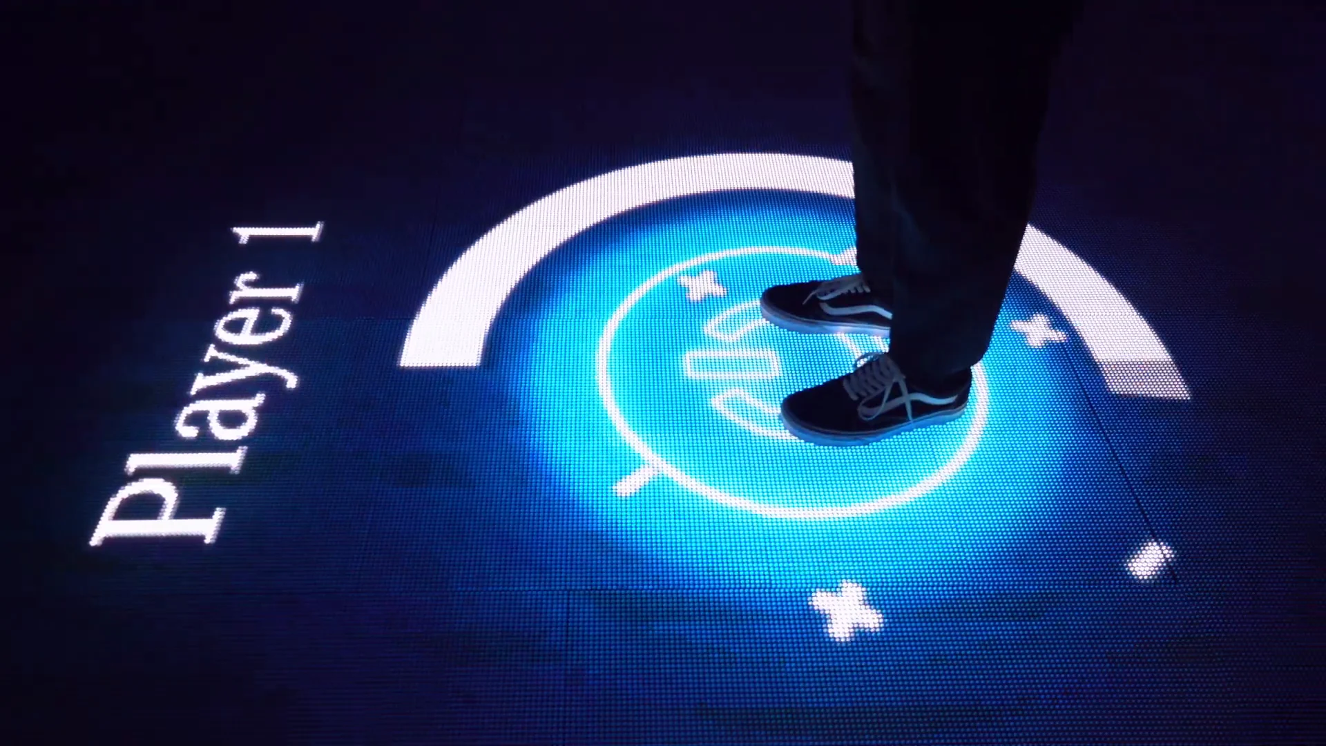 Feet on a glowing floor circle labeled Player 1