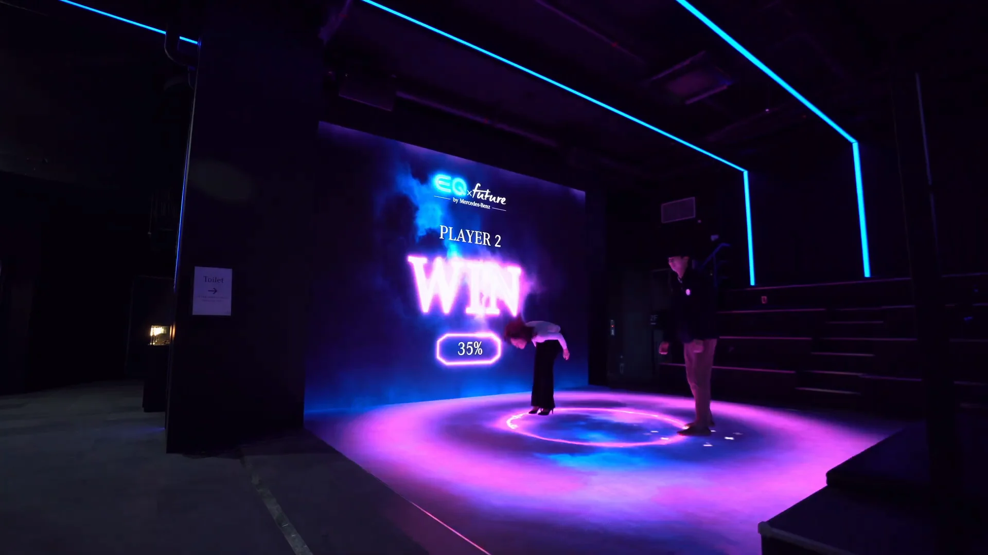A pink-lit floor and the PLAYER 2 WIN screen