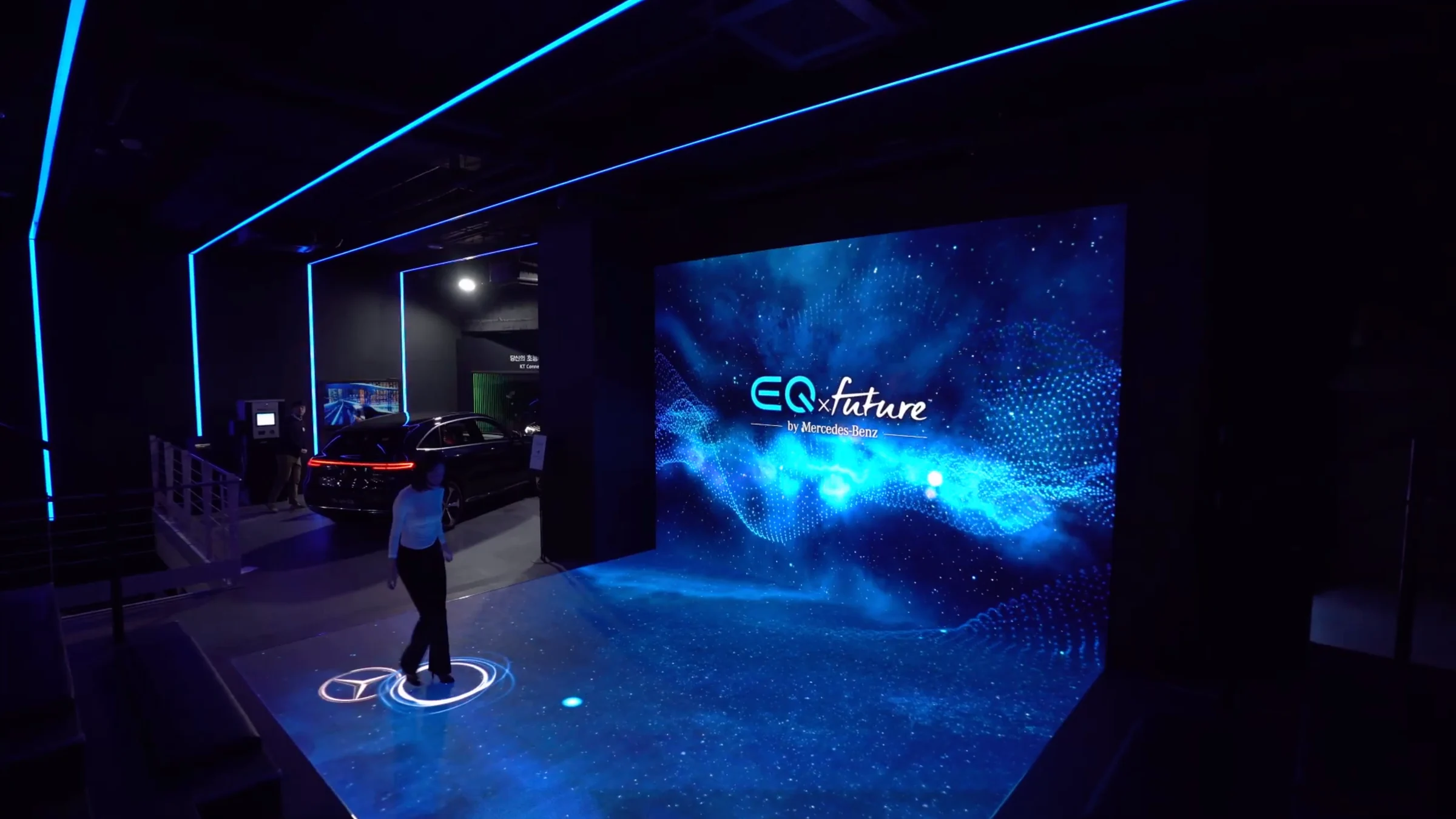 A stage with EQ future on the front LED wall and circles of light on the LED floor