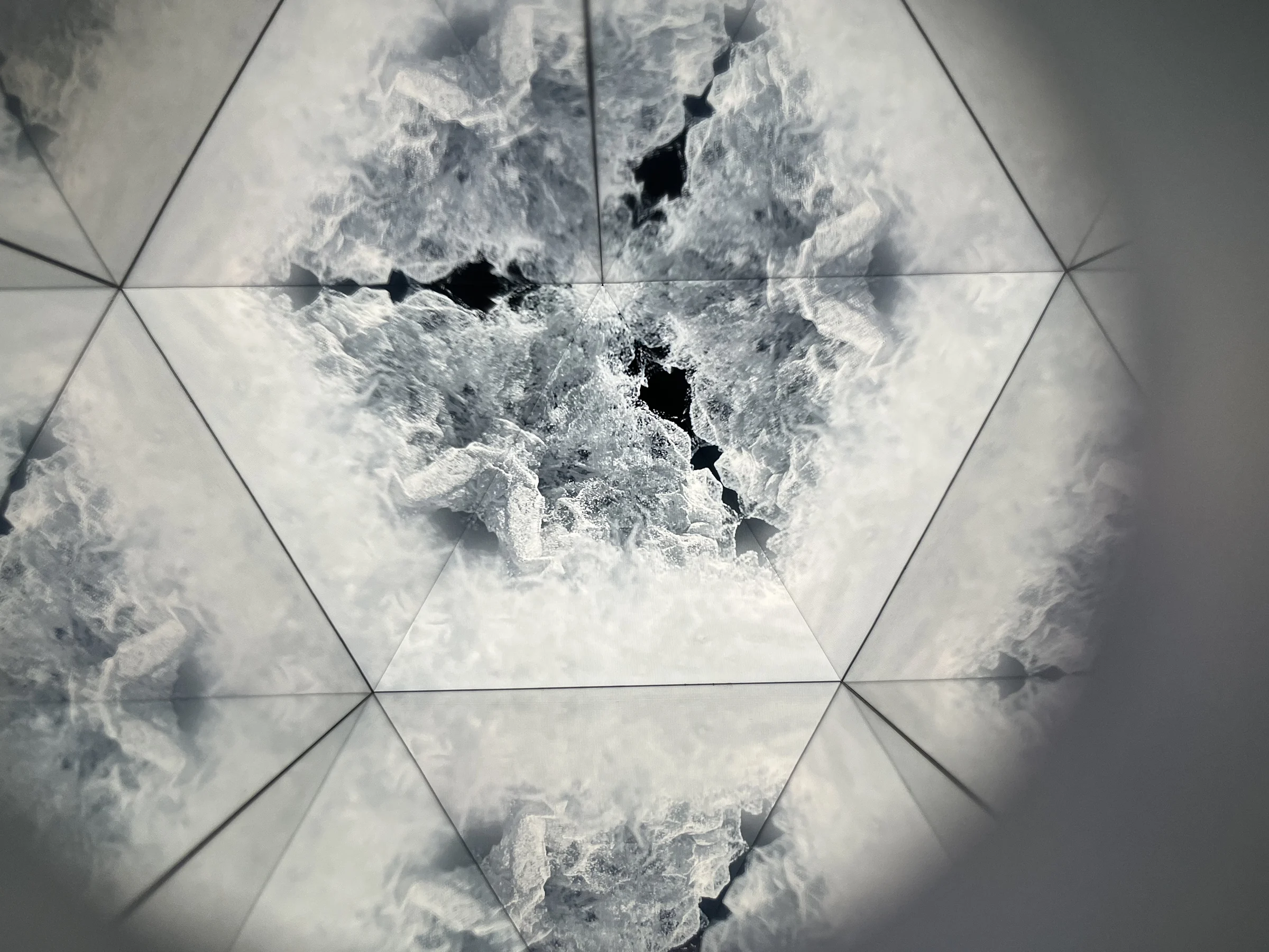 White crystals repeat in sixfold symmetry in the kaleidoscope.