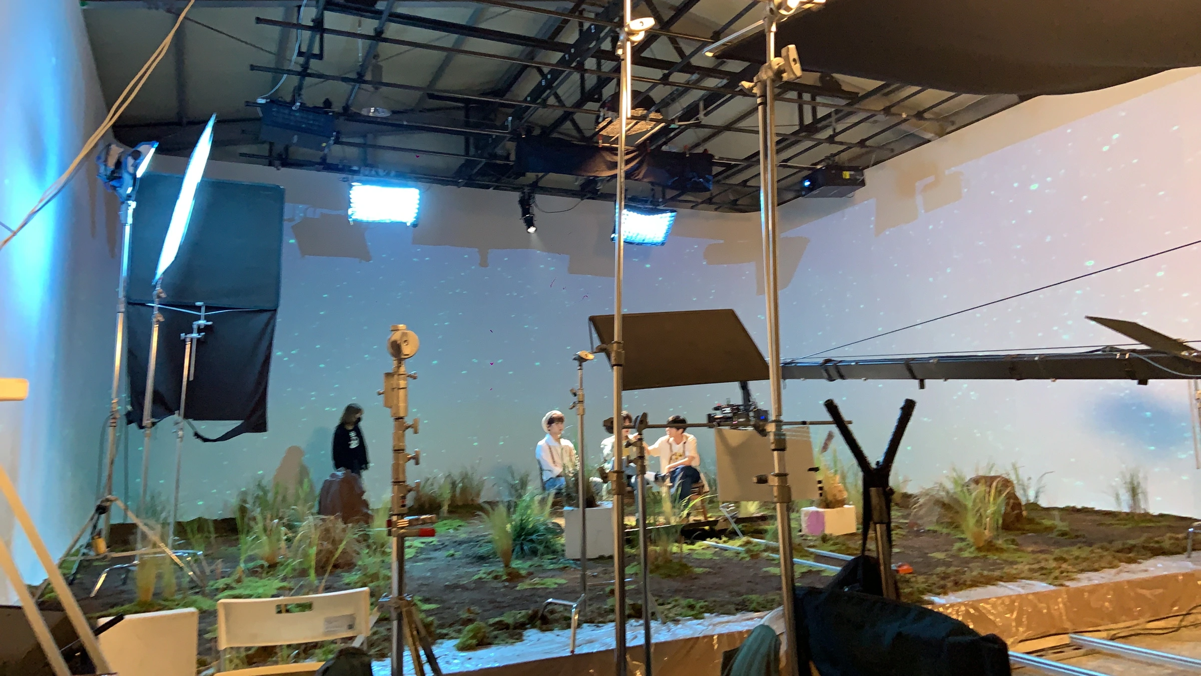 The film set with the camera and projected backdrop together