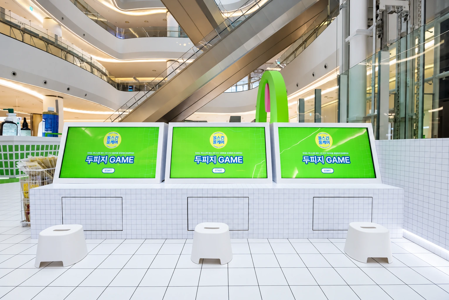Doopiji Game screens arranged along a white-tiled counter