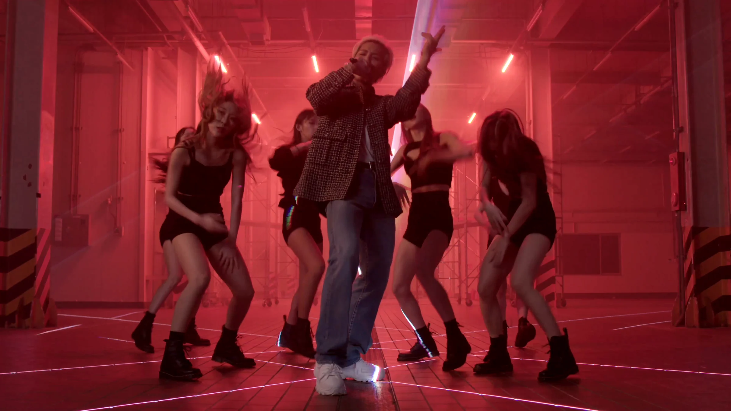 MINO and dancers above red beams tracing the floor