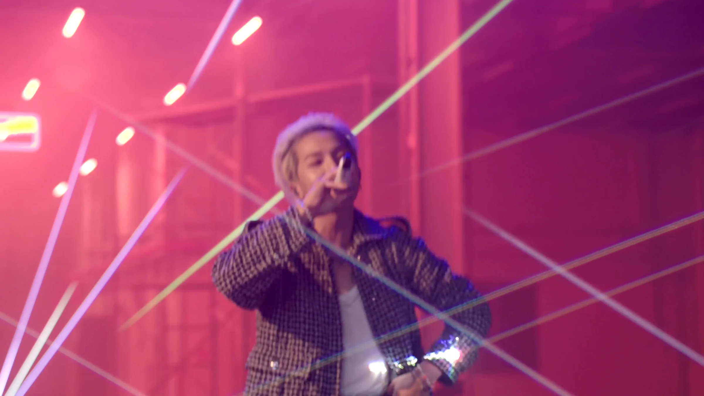 MINO and diagonal beams across a pink-lit space