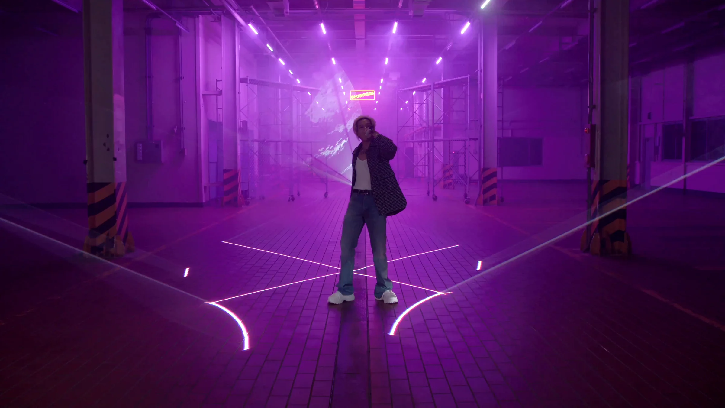 White beams tracing the violet-lit warehouse floor