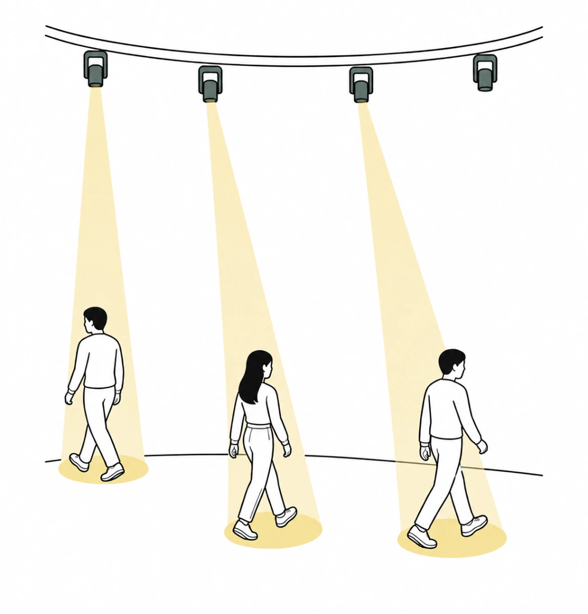 Three people walking in different directions, each with a light at their feet