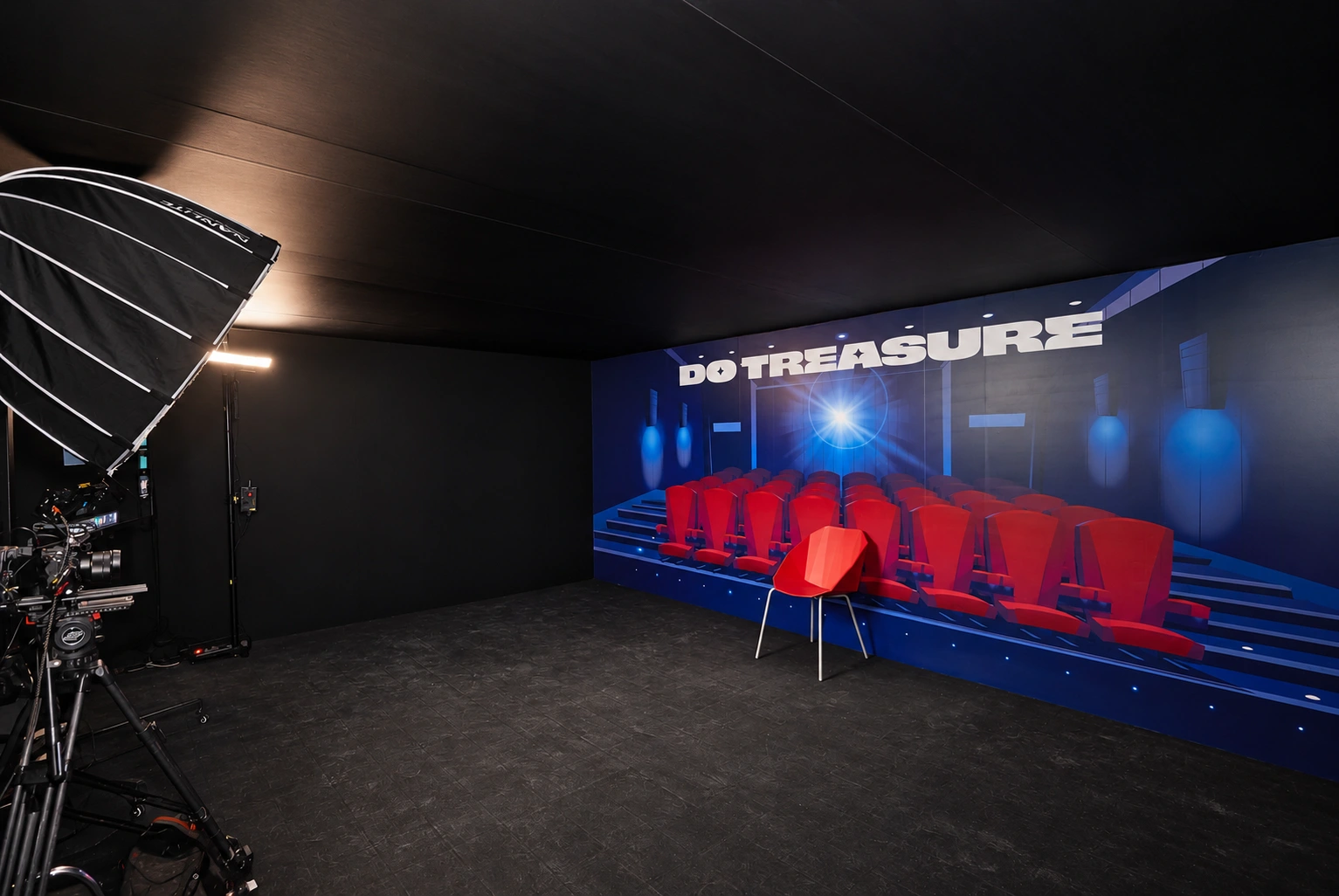 AR photo area with a camera, lighting and a designated seat for visitors