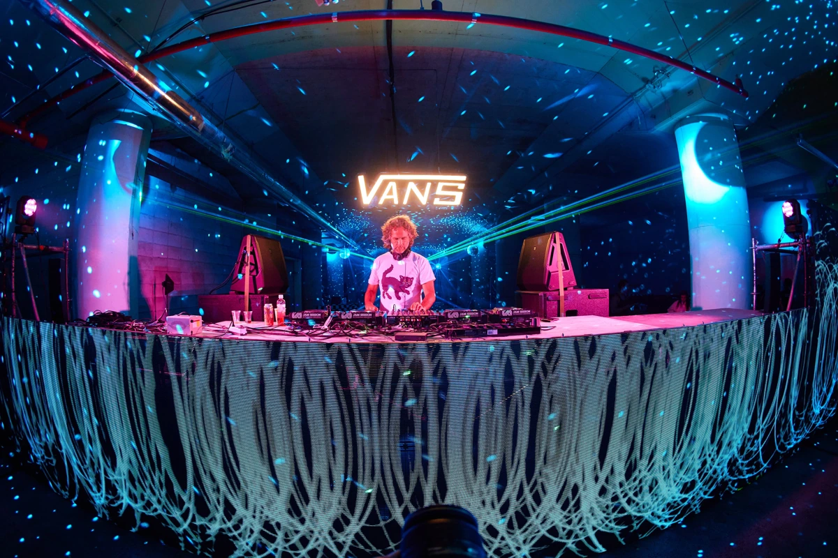 An LED booth and a stage filled with blue light