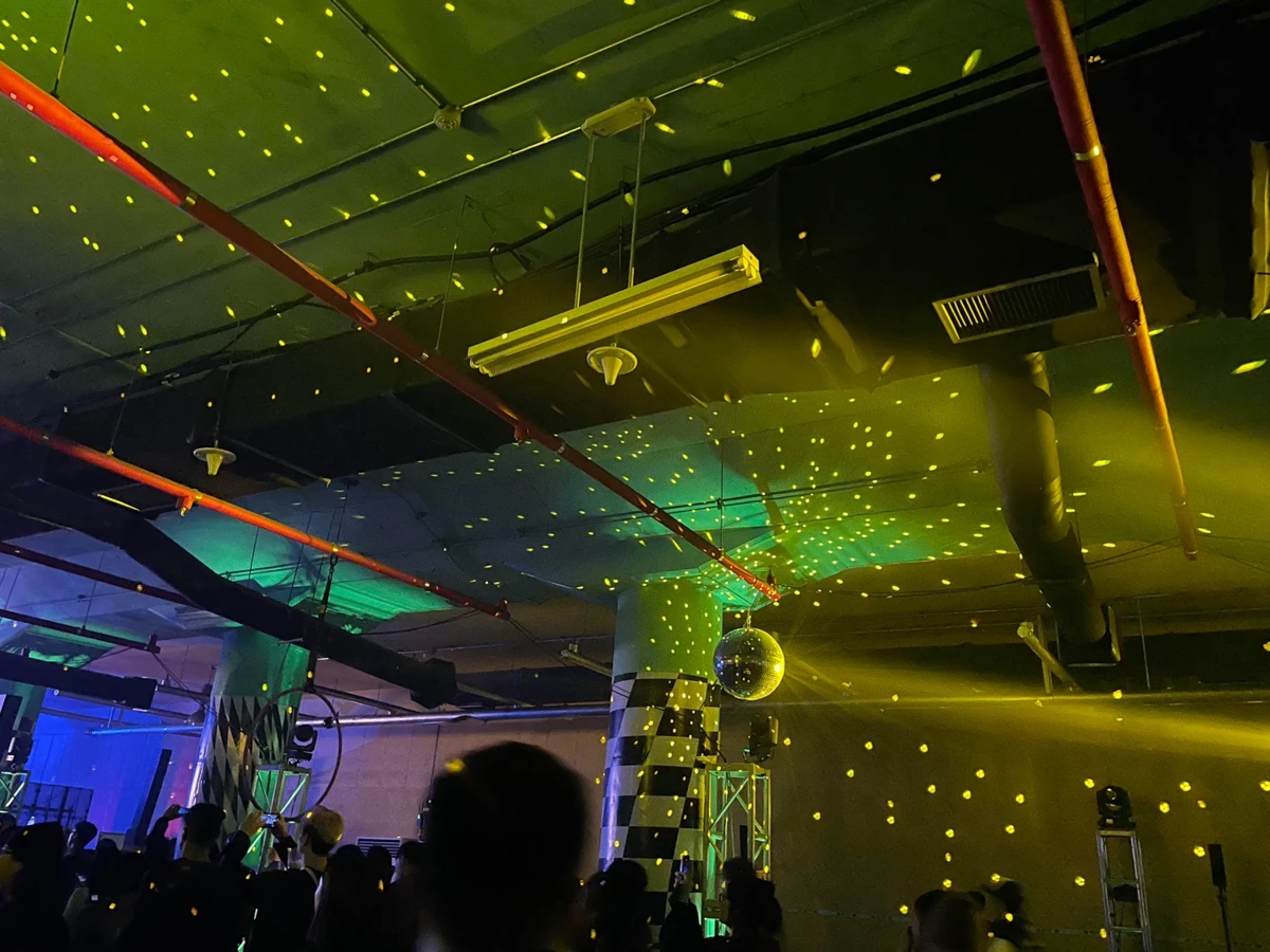 Mirror-ball light across the ceiling